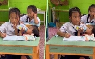 10-летняя девочка ходит в школу, одновременно ухаживая за младшей сестрой, трогает миллионы сердец в Таиланде